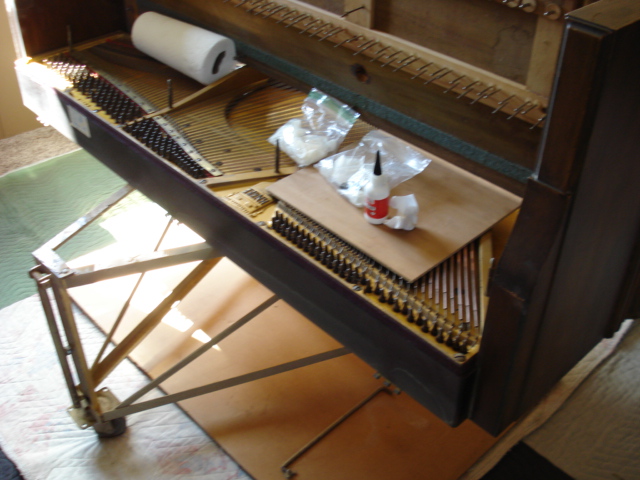 C1 - With piano on its back, AC glue installed in pinblock to increase tuning pin torque C1 - With piano on its back, AC glue installed in pinblock to increase tuning pin torque